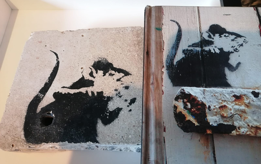 Banksy lock rat a real piece of actual Banksy graffiti on a piece of masonry